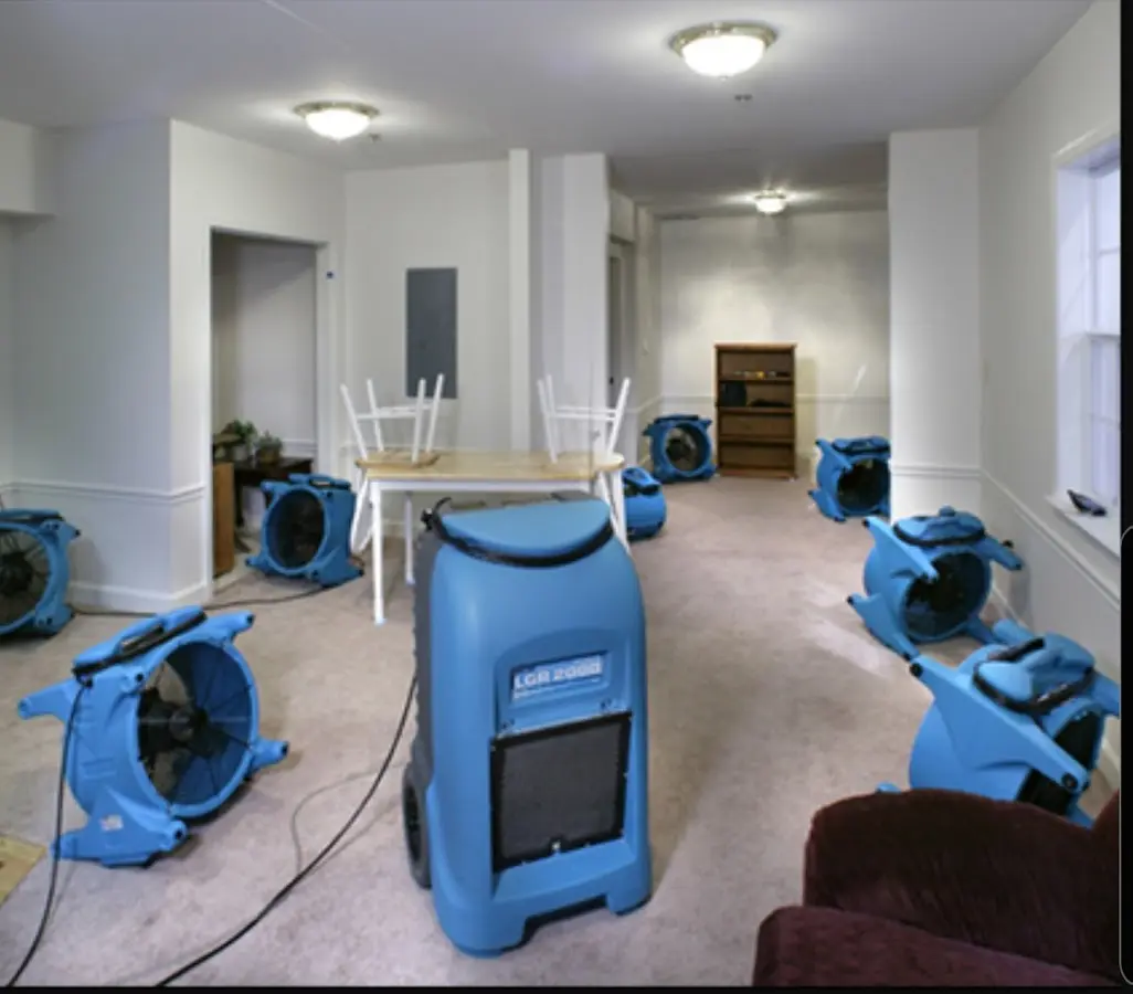 Air movers and dehumidifier setup for Water Damage Restoration in Belleville